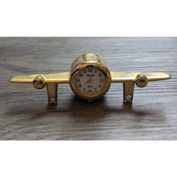Vintage Xanadu Quartz Mini Airplane Desk Clock Gold Needs Battery Paperweight - Picture 1 of 4